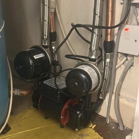 Leaking pipe joint repaired during plumbing work in Essex
