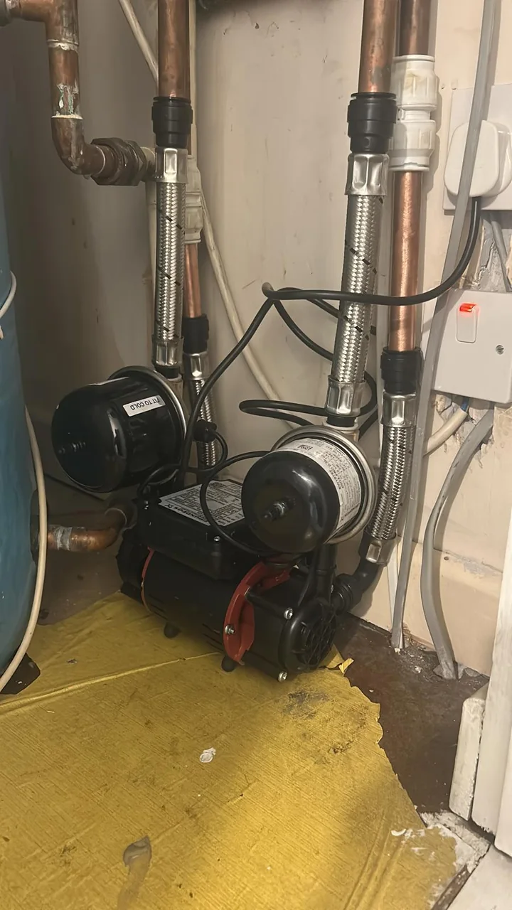 Essex plumber repairing a leaking pipe joint under a sink